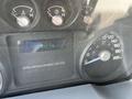 Dashboard of a 2015 Ford F-550 showing speedometer fuel gauge and odometer reading 300938 km
