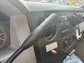 Close-up of the gear shift lever and dashboard controls in a 2009 Ford F-550 showcasing the tow haul feature