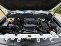 The engine compartment of a 2017 Chevrolet Colorado featuring a Duramax 2.8 engine with various components including a battery and fluid reservoirs