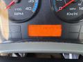 Dashboard display of a 2013 International 7500 showing RPM speedometer and hour meter with an orange screen indicating engine PTO hours and other metrics