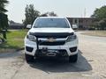 A 2017 Chevrolet Colorado pickup truck with a winch mounted on the front and a distinctive Chevy logo in the center of the grille