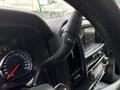 Close-up of the steering wheel controls and dashboard of a 2020 Chevrolet Silverado displaying the speedometer and multimedia interface