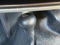 The gear shift knob for a 2014 Ford F-550 with markings for four-wheel drive settings including 2H N 4H and 4L