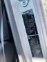 A Hino 195 vehicle identification label displaying manufacturing details and specifications mounted inside the driver's side door frame