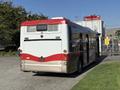 2016 Grande West Vicinity bus with a red and white design parked with its rear facing the viewer