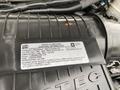 2020 Chevrolet Express engine compartment with a visible emissions control sticker detailing vehicle specifications and compliance information