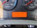 Dashboard of a 2013 International 7500 showing RPM speedometer, odometer, and hours of operation on an orange display