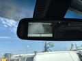 Rearview mirror displaying a camera view of the area behind a 2019 Mercedes-Benz Sprinter with a warning to check entire surroundings