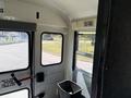 Interior view of a 2009 International 3000 CE school bus showing seats windows and a trash can