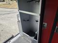 Interior of a 2011 Workhorse W62 vehicle showing an empty compartment with hooks and a textured floor