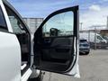 A 2020 Chevrolet Silverado with the driver's side door open showing the interior door panel
