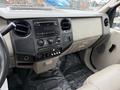 Interior view of a 2008 Ford F-250 SD dashboard featuring controls for audio climate and a textured panel labeled Super Duty