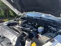 Close-up of the engine compartment of a 2018 RAM 3500 showing various components like the engine block battery and coolant reservoir