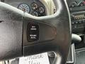 Close-up of a steering wheel in a 2012 International TerraStar featuring cruise control buttons labeled SET/CRUISE and RESUME/ACCEL