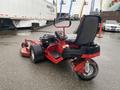 A red 2017 Ferris Rotary lawn mower with a high-back seat and a powerful engine visible behind the seat