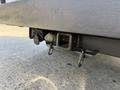 Hitch receiver and wiring harness of a 2015 Ford F-550 with two securing hooks attached