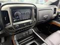 Interior view of a 2017 Chevrolet Silverado 1500 featuring a large touchscreen display and dashboard controls
