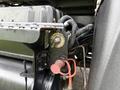 Close-up of a 2012 International 7400 with mechanical components including a valve and hoses in view