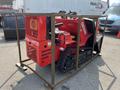 A 2025 AGT Industrial SDA-140TZ snow removal machine with a red exterior and tracks is secured within a metal frame