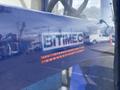 A close-up view of a blue Bitimec SC415 machinery logo featuring the text Bitimec International Connecticut USA