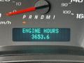 Digital display showing the engine hours as 3653.6 on a dashboard of a 2021 Chevrolet Express