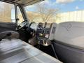 Interior view of a 2017 International 4300 showing the driver's seat steering wheel dashboard and control panel with various gauges and buttons