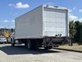 A white 2020 Hino 338 box truck with a smooth rear and a horizontal bumper visible at the back