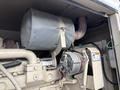 A 2005 Katolight SED60FPJ4 generator with a large silver exhaust cover and a prominent electric motor visible in the foreground