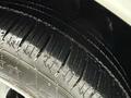 Close-up of a wet tire tread from a 2017 RAM ProMaster City showcasing deep grooves and patterned rubber surface for traction