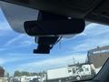 Interior view of a 2018 Toyota Highlander showing the rearview mirror and a mounted camera system hanging below it