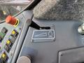 Control panel of a 2018 Sandvik Ranger DX800 featuring levers buttons and gauges for operation settings and adjustments