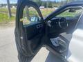 A 2020 Ford Explorer with the driver's door open showcasing the interior features and seating area