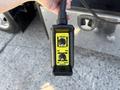 A black and yellow control panel with buttons labeled hoist winch up down and in out