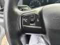 Close-up of the steering wheel controls of a 2021 Ford Transit-350 featuring volume and call buttons