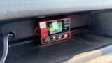 A red fire suppression system control panel displaying a status message in a 2021 Ford Transit