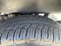 A close-up view of a 2017 Chevrolet Colorado tire showing detailed tread patterns and sidewall markings