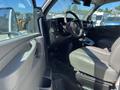Interior view of a 2013 Chevrolet Express showing the driver's seat dashboard and steering wheel