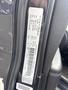 A 2015 Dodge Durango vehicle identification number label with details about the car's specifications and manufacturing information