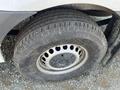 Close-up of a tire on a 2022 Mercedes-Benz Sprinter with a silver wheel rim and worn tread