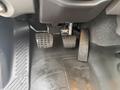 Interior of a 2016 Freightliner 108SD showing the accelerator and brake pedals on a textured floor mat