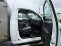 A 2011 Dodge Ram 5500 with the driver's side door open showcasing the interior seating and dashboard