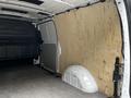 A 2020 Mercedes-Benz Metris van interior with wooden panels lining the walls and a curved section at the back near the floor