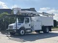 A 2019 Freightliner M2 106 utility truck with an elevated hydraulic lift and spacious storage compartments on the side