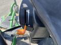 Close-up of the control lever of a 2016 John Deere 1585 Terrain Cut mower with an orange handle and a white indicator mark