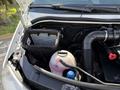 A 2016 Mercedes-Benz Sprinter engine compartment showcasing the air filter housing and fluid reservoirs