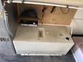 A 2008 Wells Industries Inc EW1422 food warming appliance with a rectangular, white body featuring a compartment and a temperature control knob