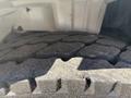 Close-up of a textured tire tread from a 2005 Freightliner M2 106 showing distinct grooves and rugged pattern designed for traction