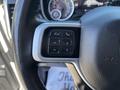 Steering wheel controls of a 2021 RAM 5500 featuring buttons for voice recognition phone and various settings