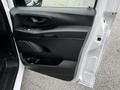 Interior door panel of a 2020 Mercedes-Benz Metris featuring black plastic trim and controls for windows and locks