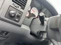 Interior dashboard of a 2006 Dodge Ram 2500 showing controls and gauges with a focus on the gear shift and various knobs
